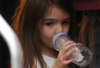 Suri Cruise with a Bottle