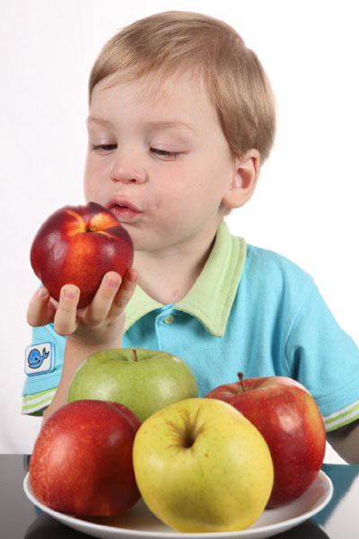 Child eating peach