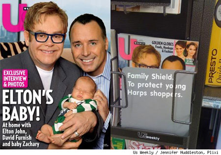Elton John and David Furnish with son