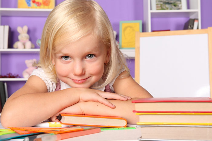 700-gp-girl-child-home-table-homework-smile-kid